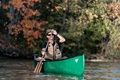 Nova Craft Prospector 14 Tuffstuff Canoe being paddled by one person on a lake