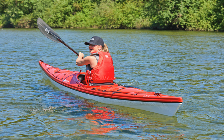 Paddling the Delta 15s kayak on a calm lake