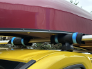 Enigma 25cm Roof Bar Pads in use with a canoe on a roof rack