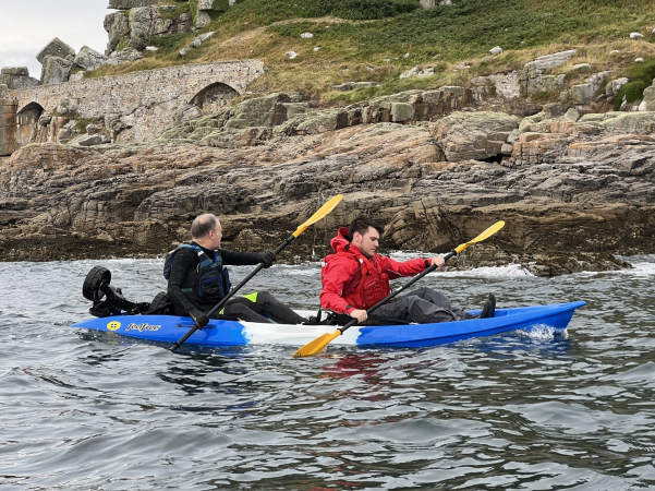 Paddling along the coast on the Feelfree Gemini Sport tandem kayak