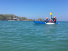 Paddling along the coast on the Feelfree Gemini Sport tandem kayak