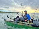 catching fish from a kayak whilst wearing the Palm Kola Angler PFD