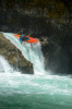 A paddler dropping down a whitewater fall in the Pyranha Scorch X kayak