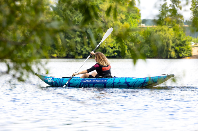 Exploring a lake on an inflatable kayak