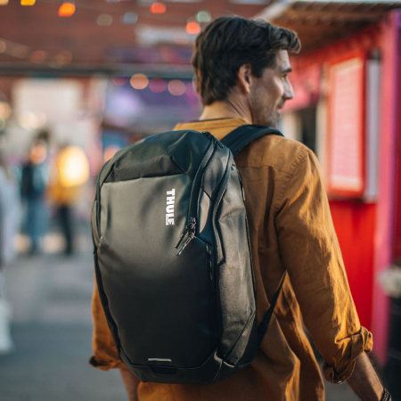Thule Chasm Backpack in Black being worn by a man