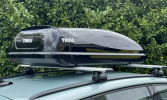 The Thule Ocean 200 Roof Box fitted to roof bars on a car