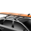Thule Surf Roof Rack Pads being used to carry a surf board on a roof rack