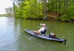 Paddling the Vibe Sea Ghost 130 fishing kayak on a quiet river