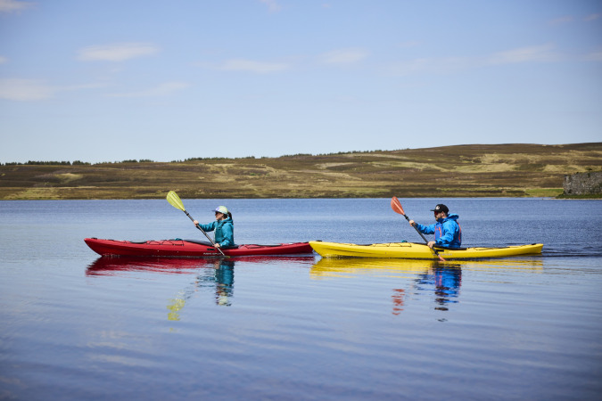 Padlding the Wave Sport Hydra 125 on a Lake