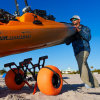 Loading a kayak onto the Yak Attack TowNStow Bunkster Cart with Sand Tires