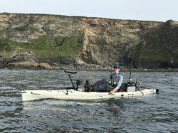 Staff Member Liam paddling his Hobie Revolution 16