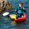 Islander Koa kayak with an adult and child