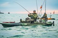 Old Town Bigwater 132 PDL kayak with angler catching a fish