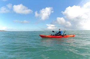 Cornwall Canoes staff Liam paddling the Perception Triumph Angler off the Cornish Coast